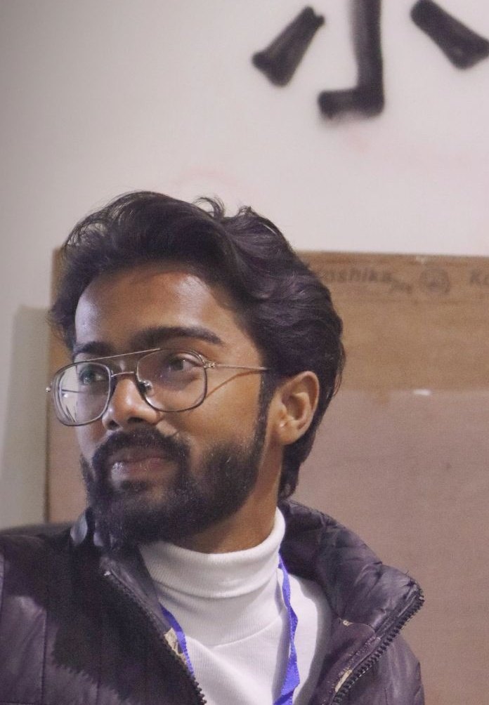 Pranjul Rathour, GenAI engineer from Kanpur, in a white turtleneck and black jacket, looking to the side