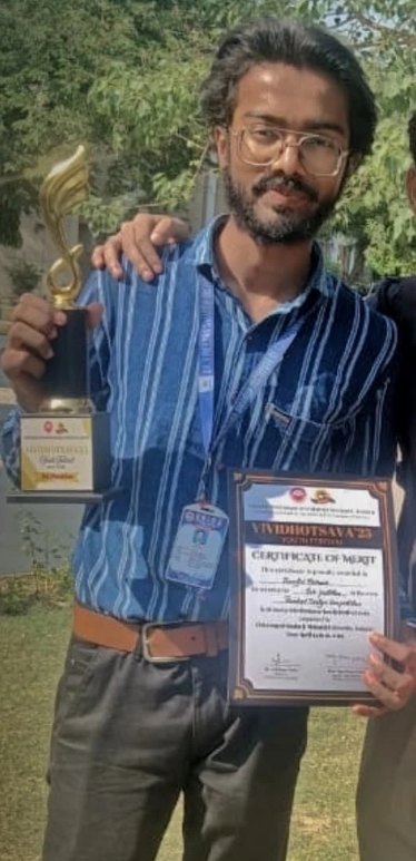 Pranjul Rathour holding a trophy and a certificate of merit after a win